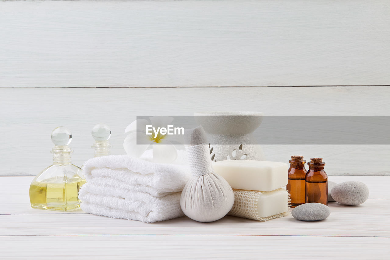 Arrangement of spa equipment on wooden table