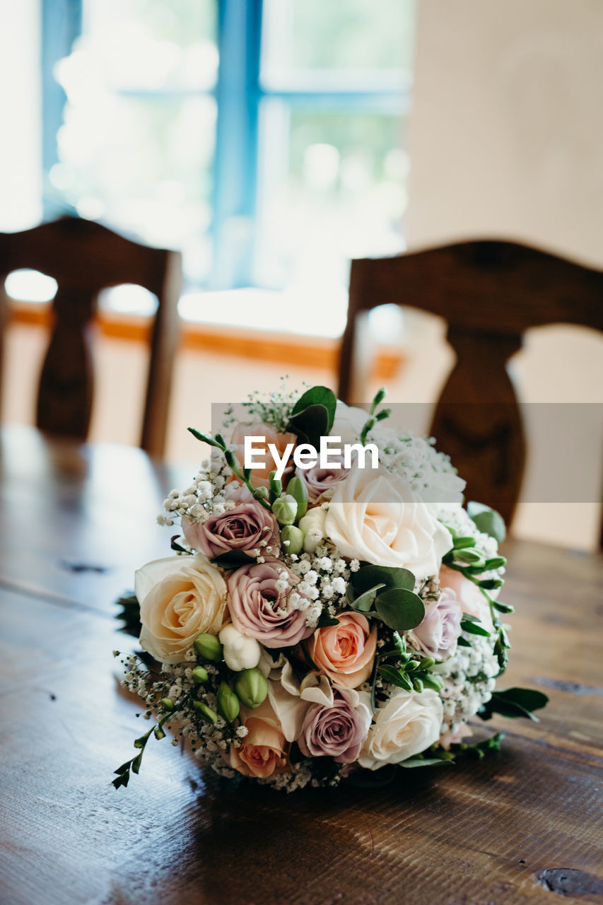 Close-up of rose bouquet on table at home