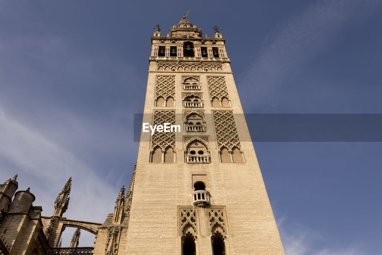 Low angle view of la giralda against sky