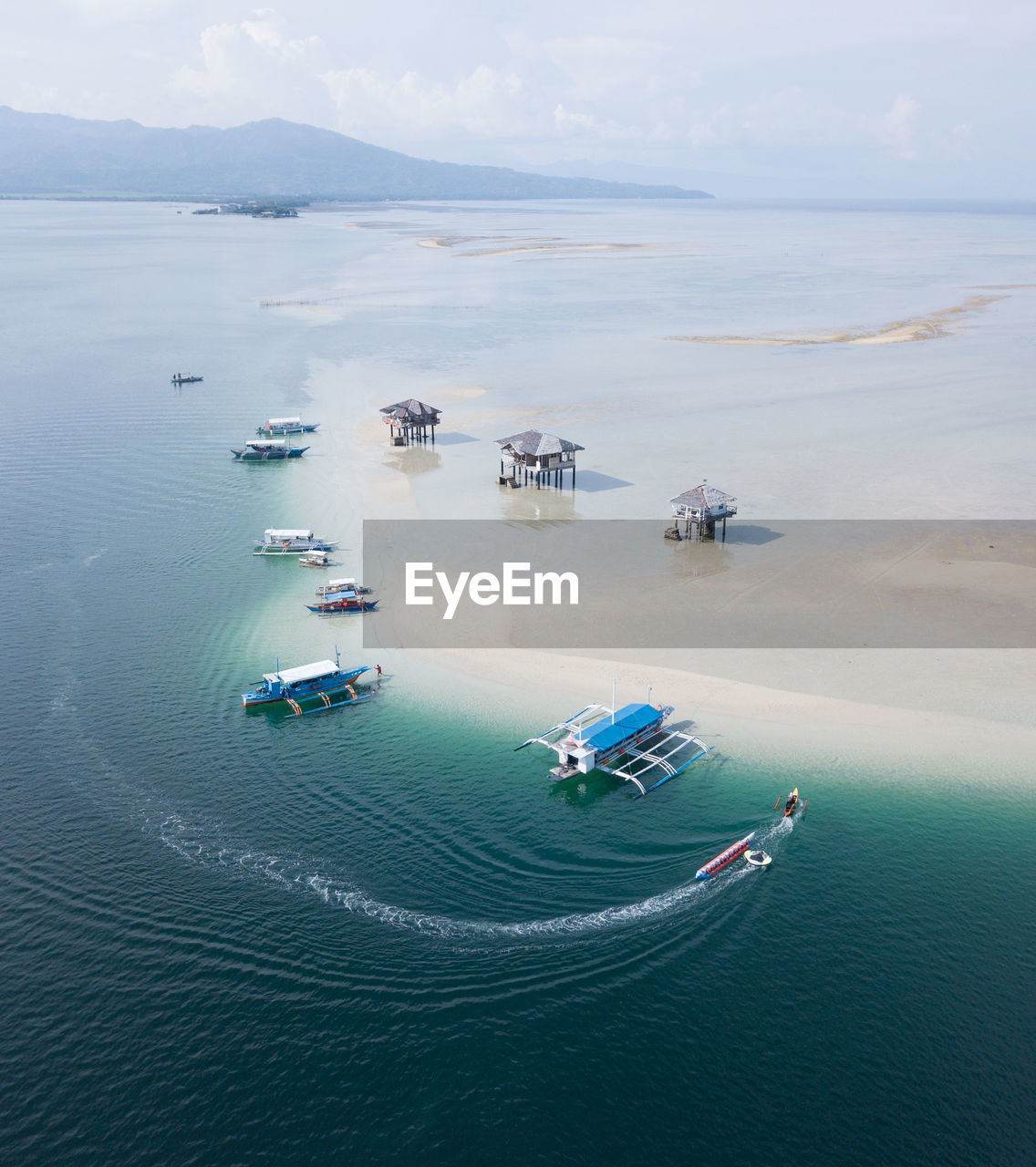 High angle view of boats in sea against sky