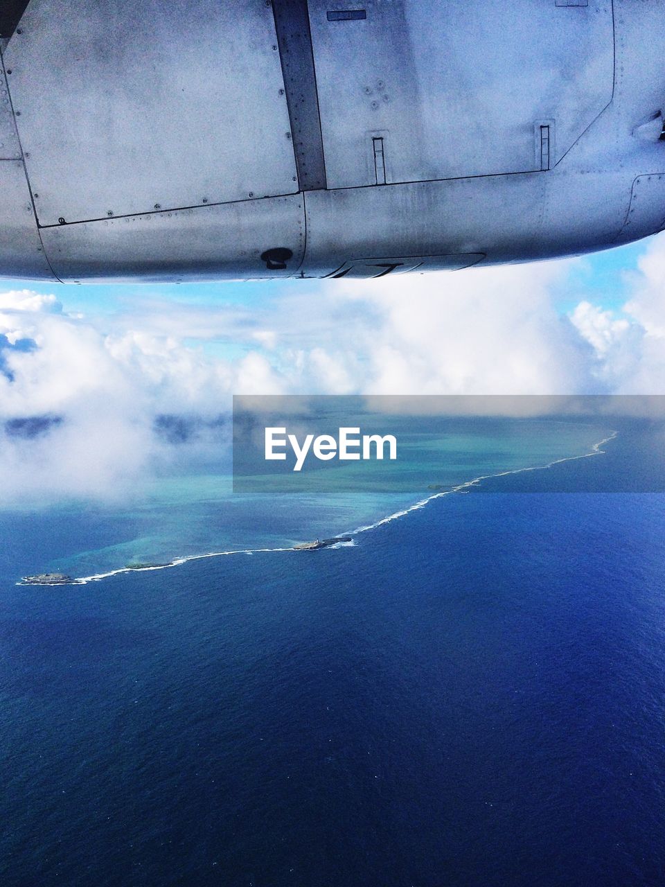 VIEW OF SEA AGAINST CLOUDY SKY