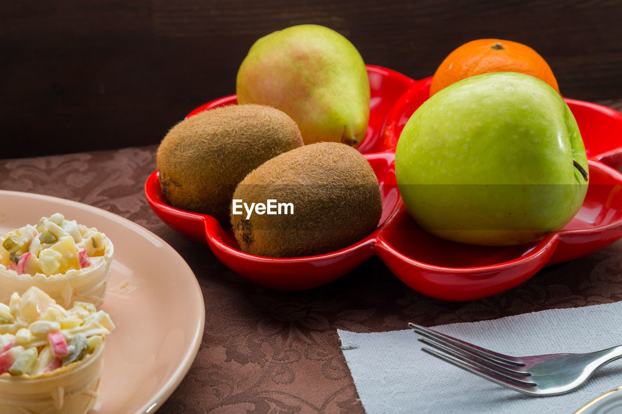 high angle view of apples in plate on table