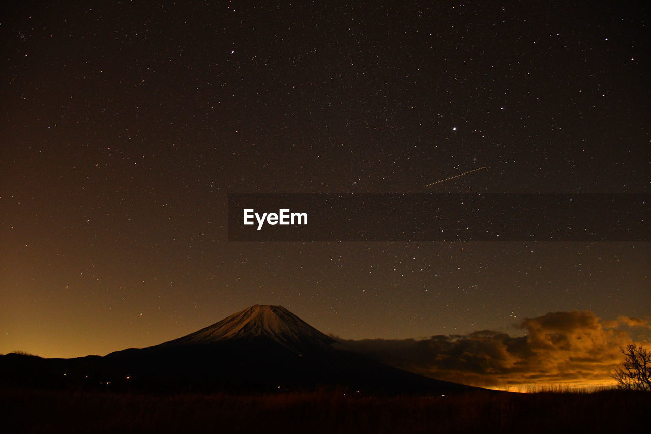 Scenic view of mountains against sky at night mt.fuji