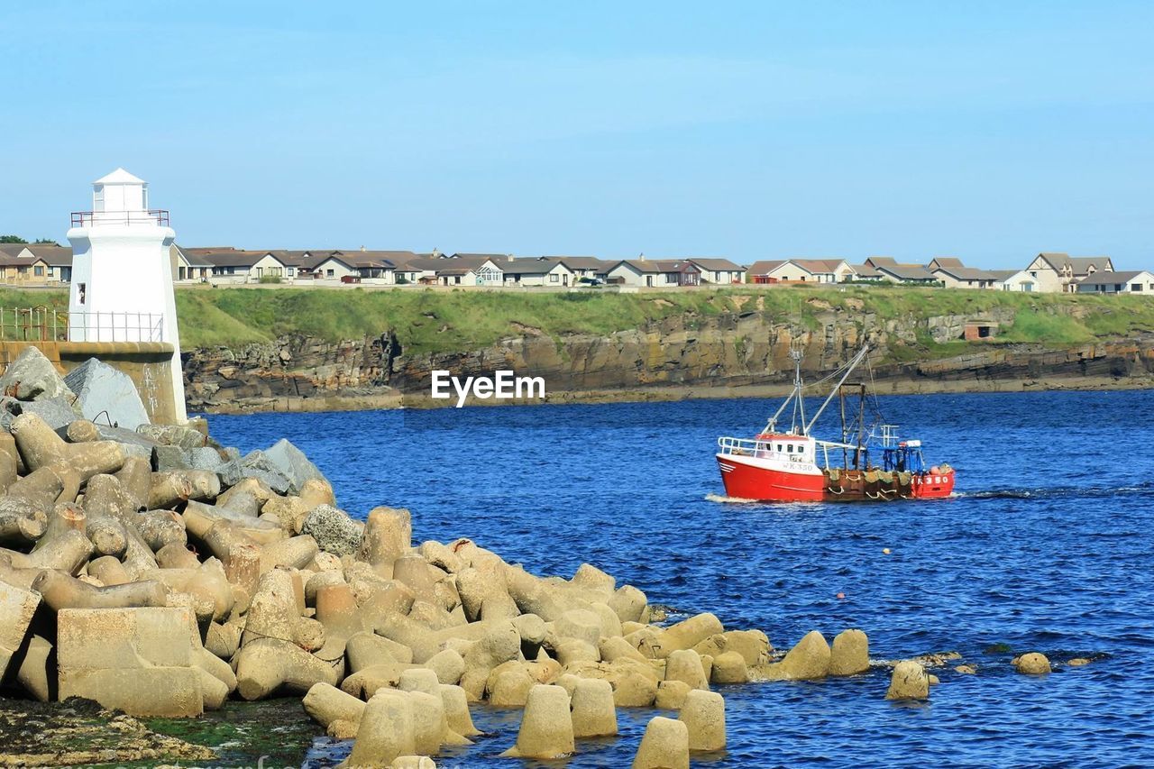 Scenic view of sea against clear blue sky