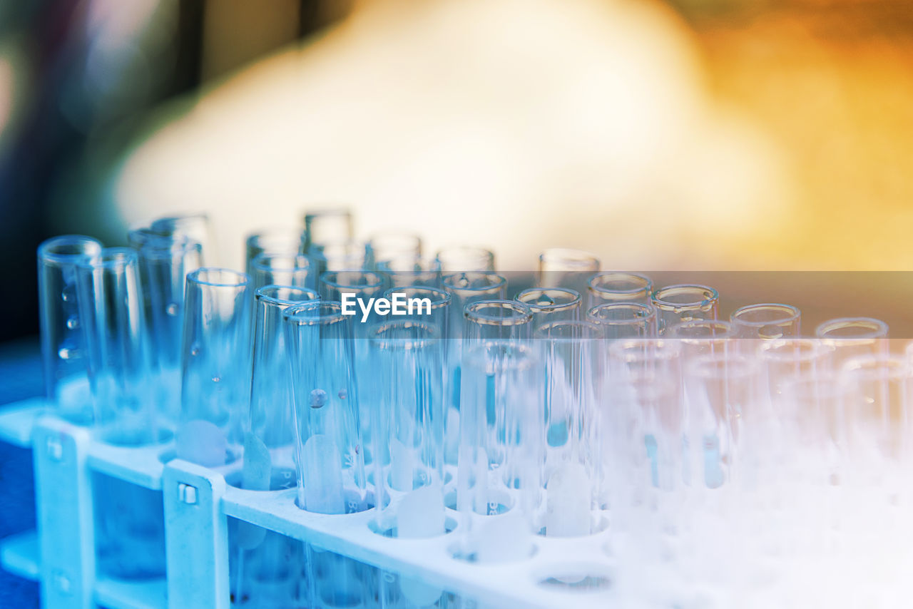 Close-up of empty test tubes in rack