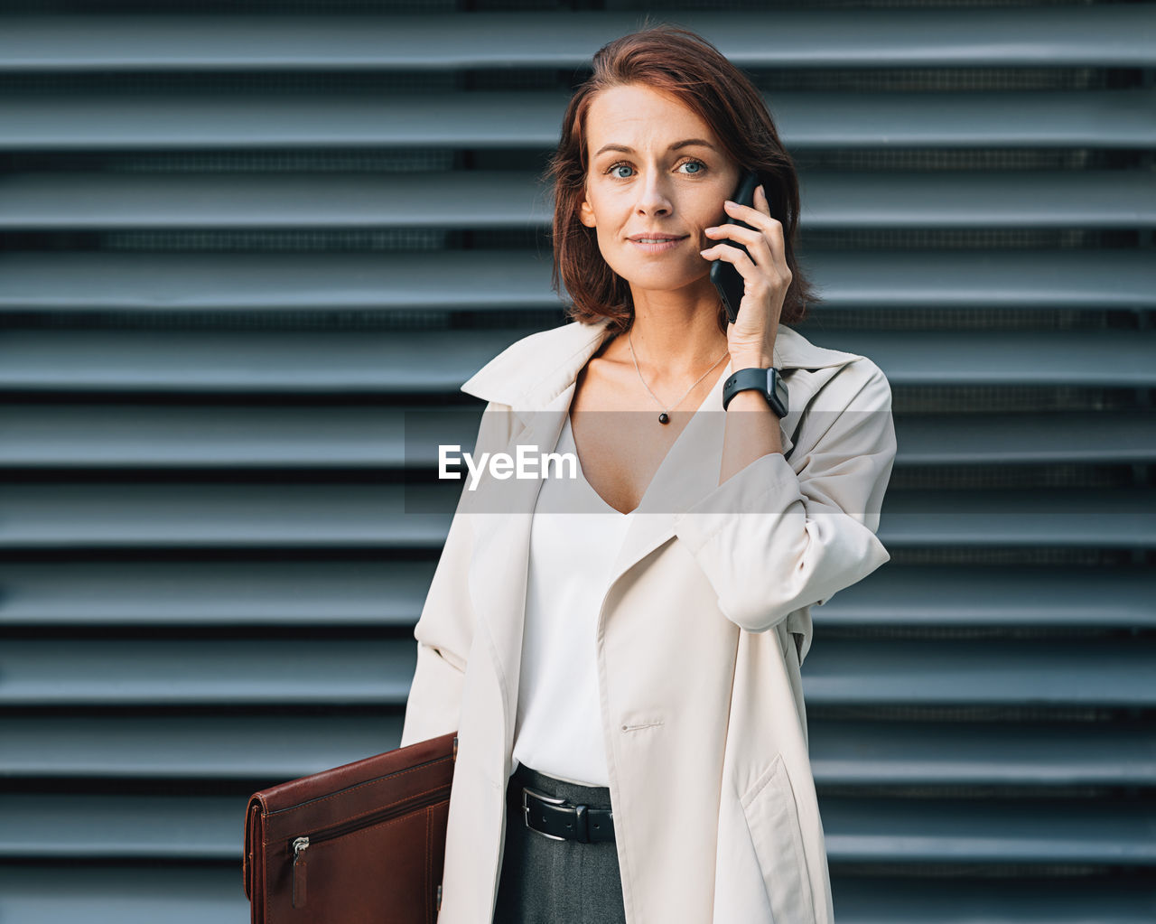 portrait of young woman using mobile phone