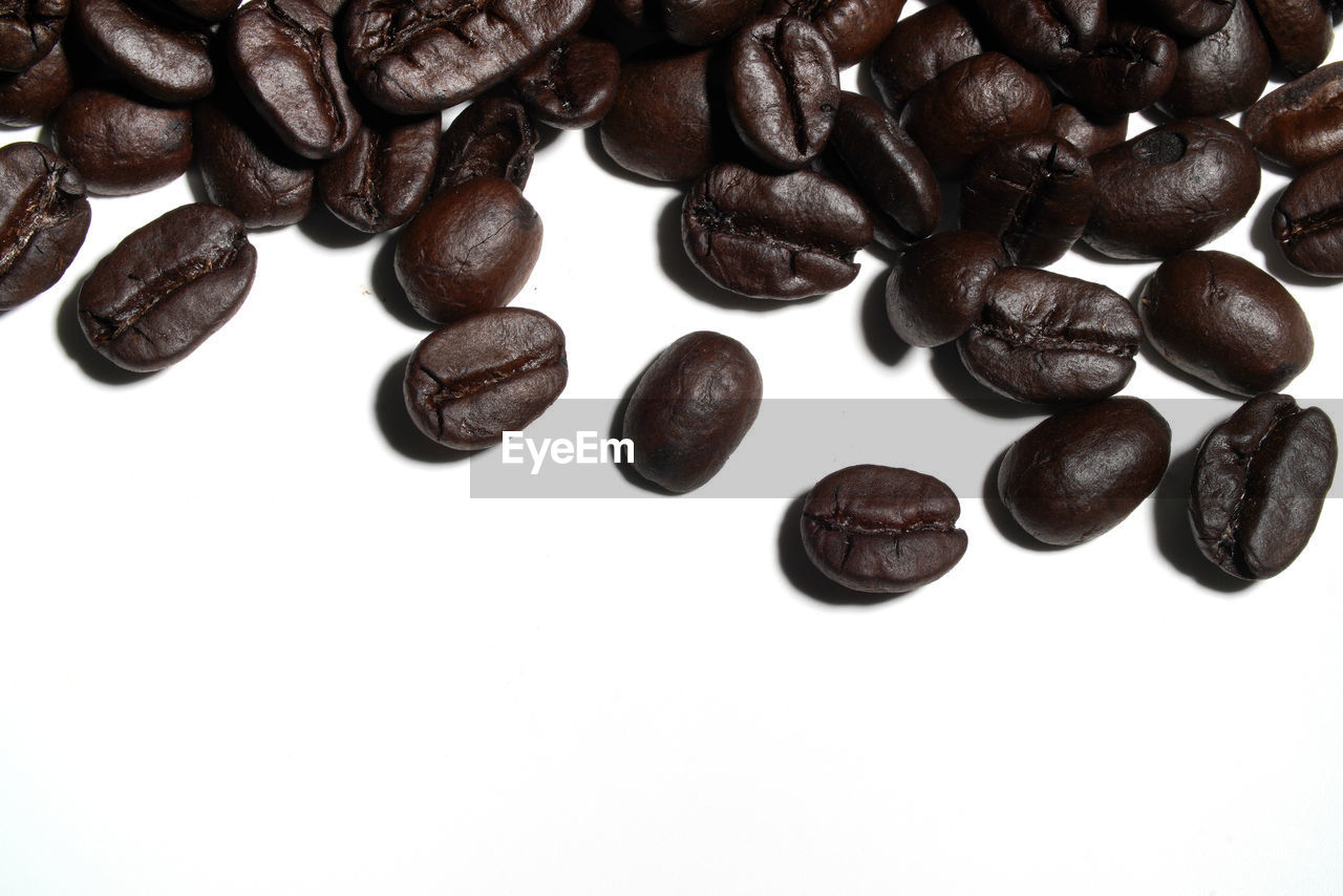 CLOSE-UP OF COFFEE BEANS IN BACKGROUND