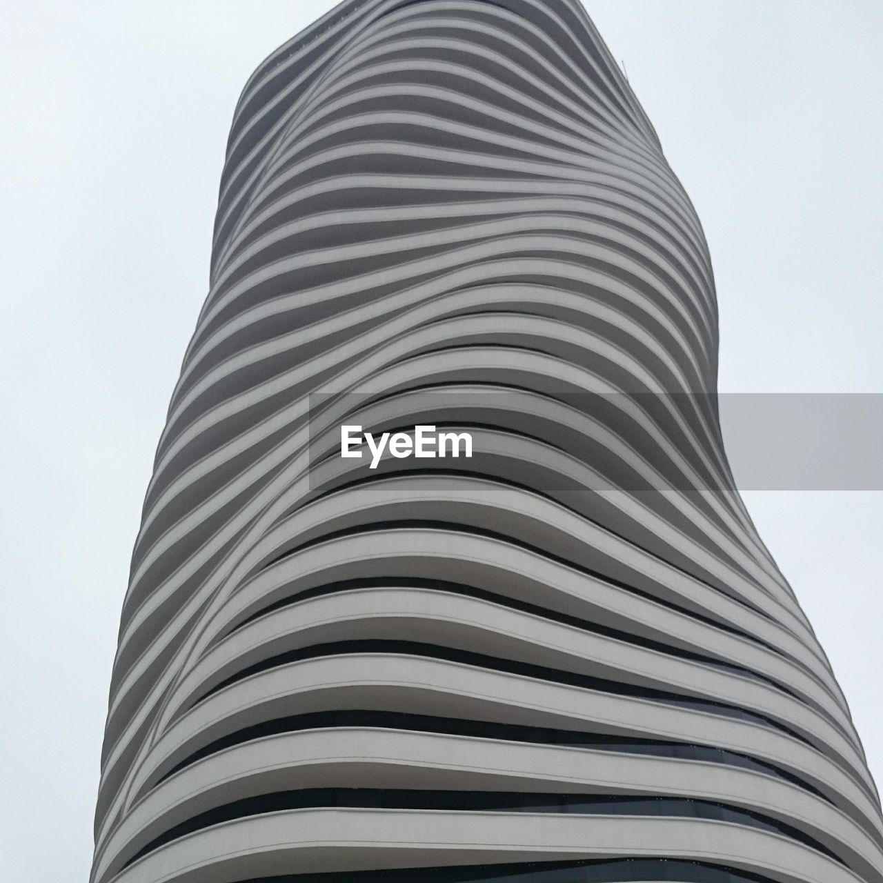 LOW ANGLE VIEW OF MODERN BUILDINGS AGAINST CLEAR SKY