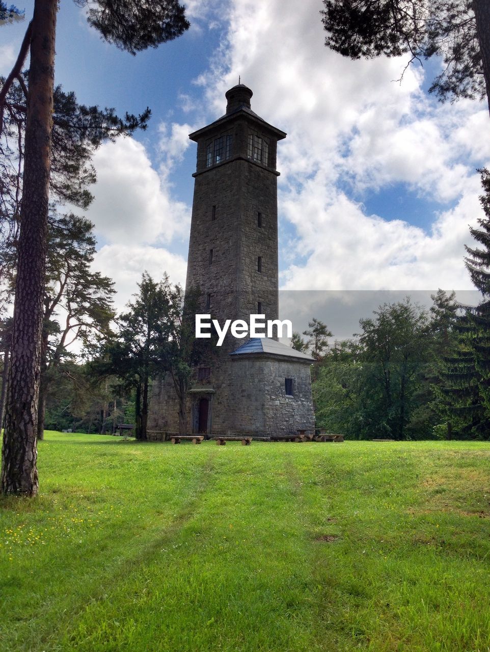 View of tower in lawn against sky
