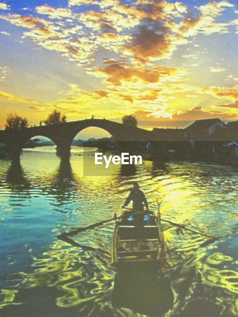 SCENIC VIEW OF RIVER AT SUNSET