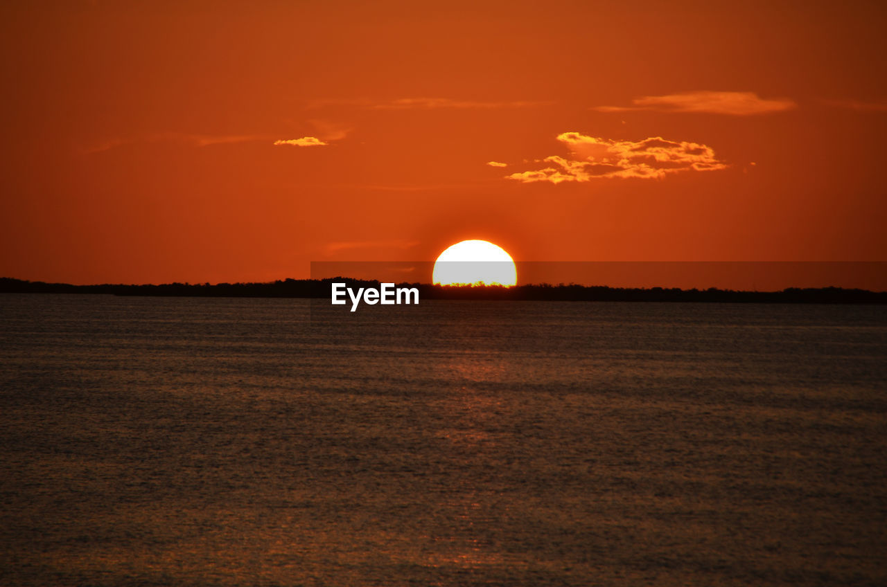 SCENIC VIEW OF SUNSET OVER SEA