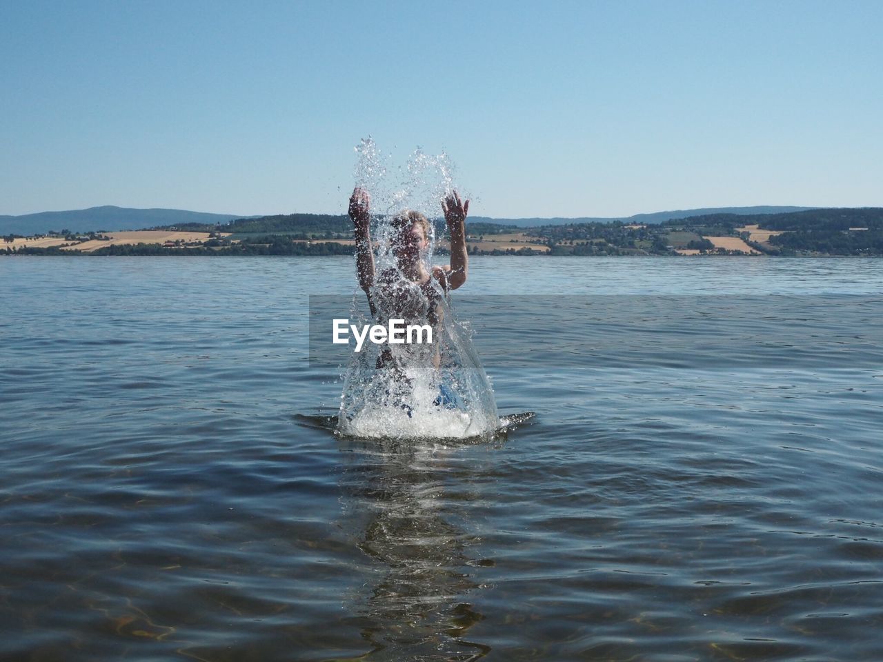 PEOPLE SWIMMING IN SEA