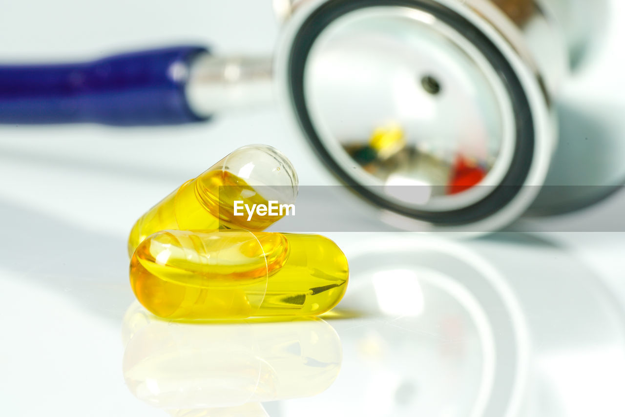 Close-up of medicines and stethoscope on table