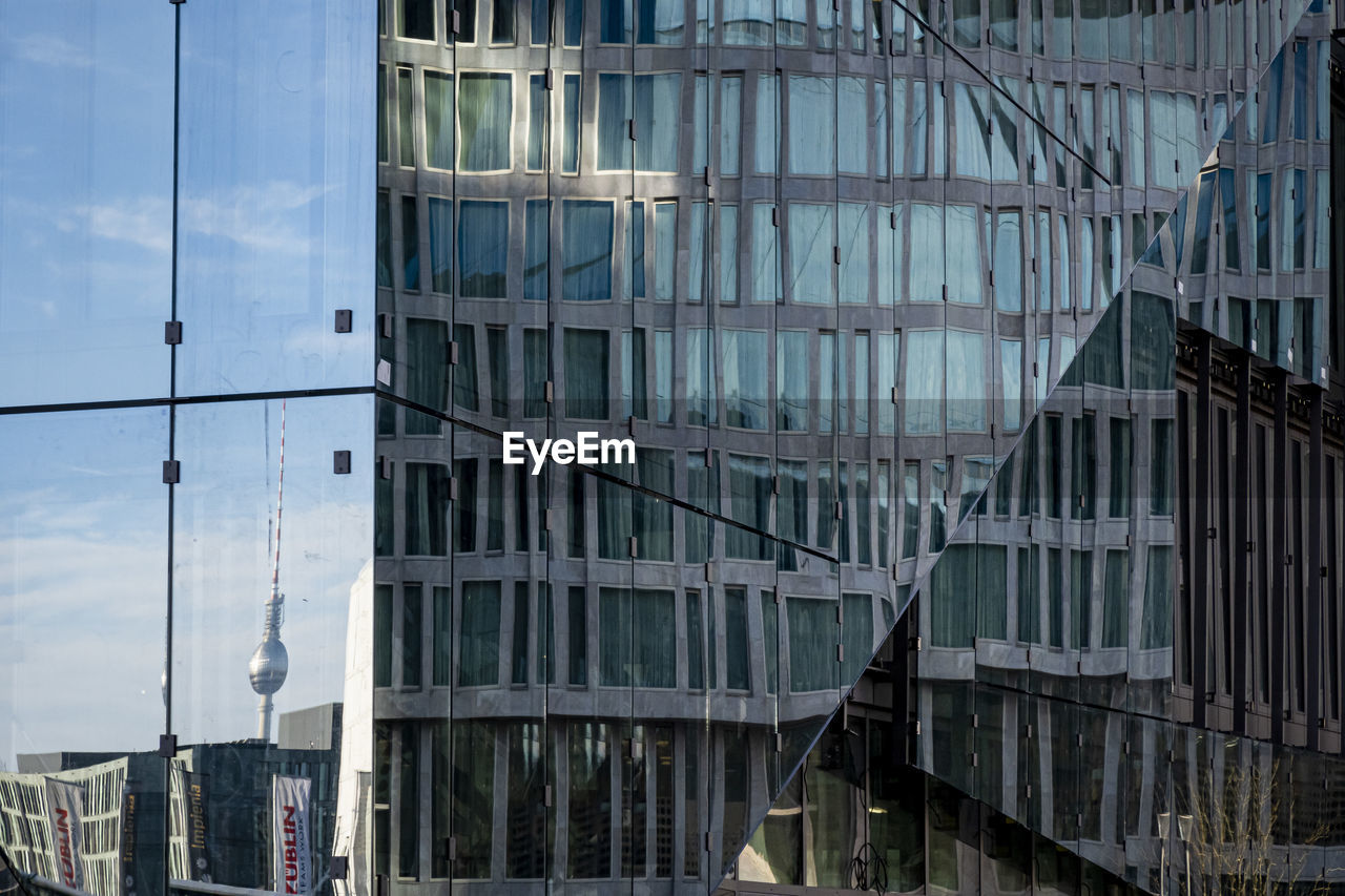 Reflection of buildings on glass window