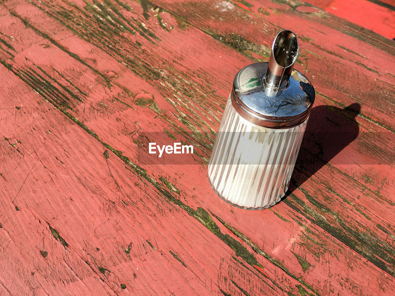 High angle view of glass container on table