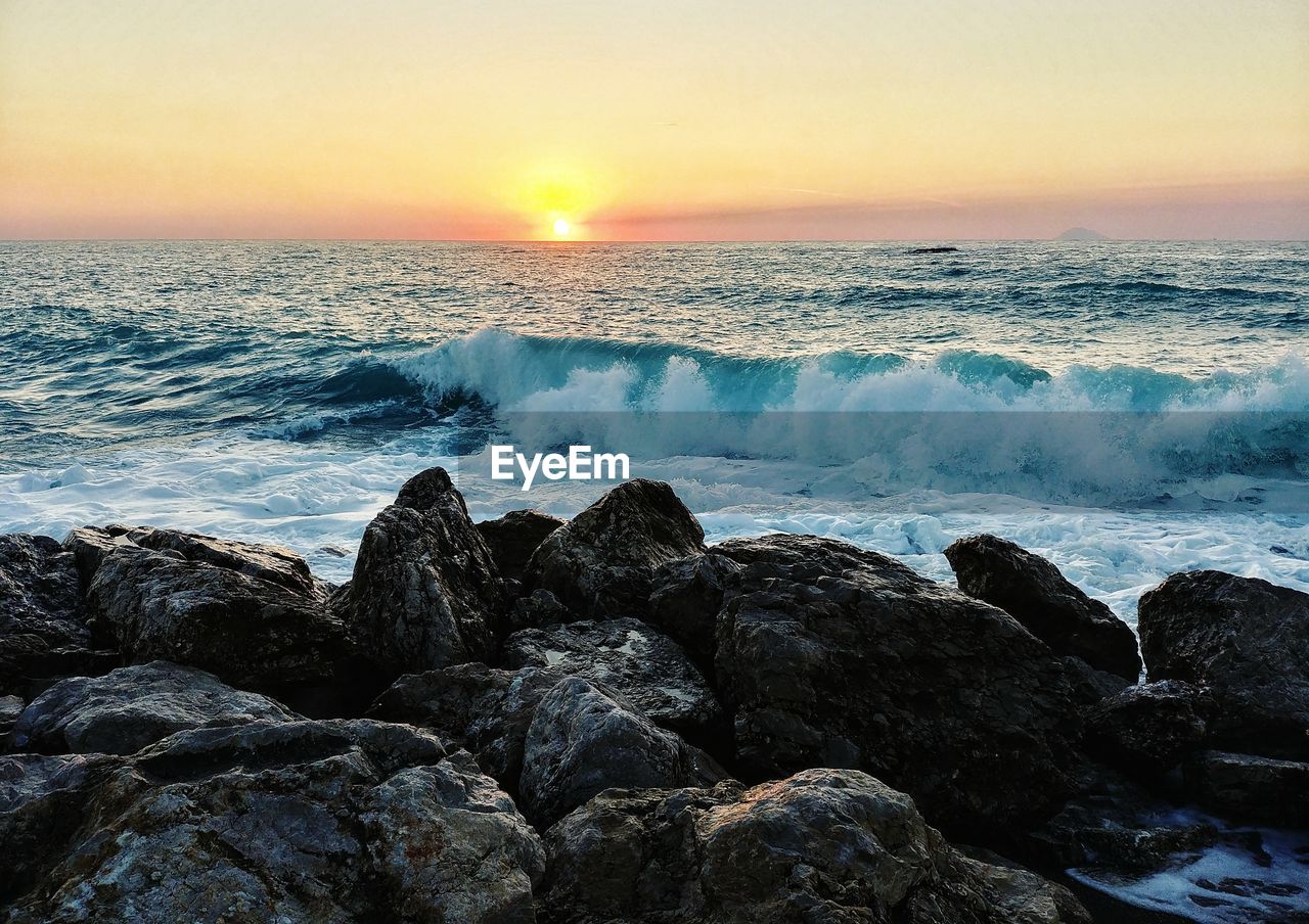 SCENIC VIEW OF BEACH AGAINST CLEAR SKY