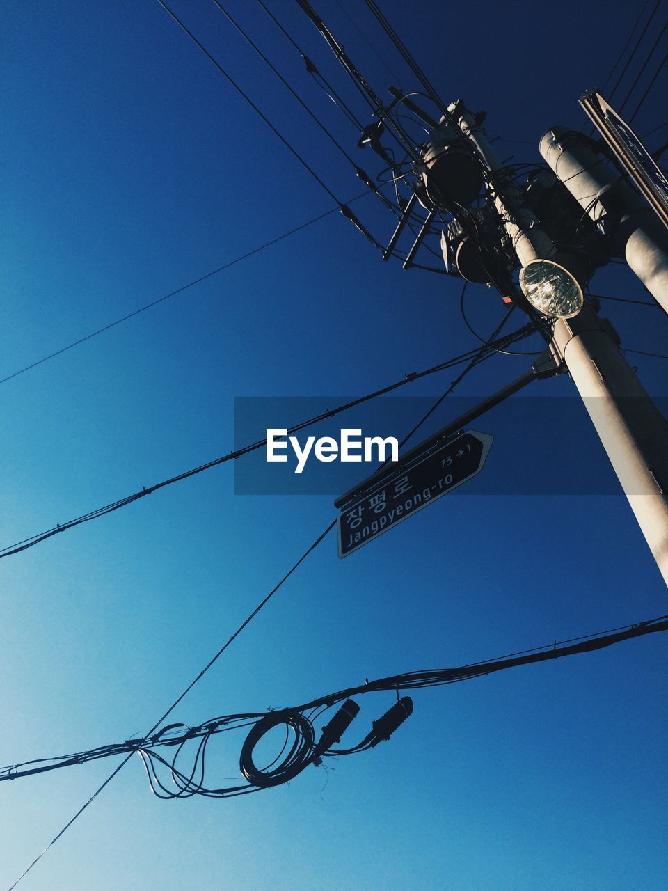 LOW ANGLE VIEW OF ELECTRICITY PYLONS