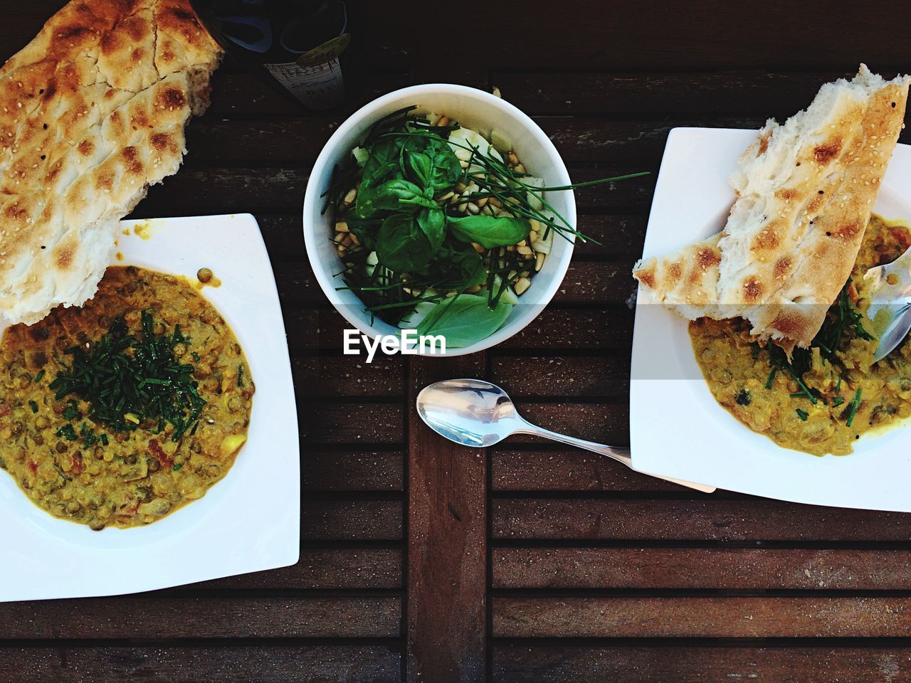 High angle view of food served with tortilla - flatbread on wooden table