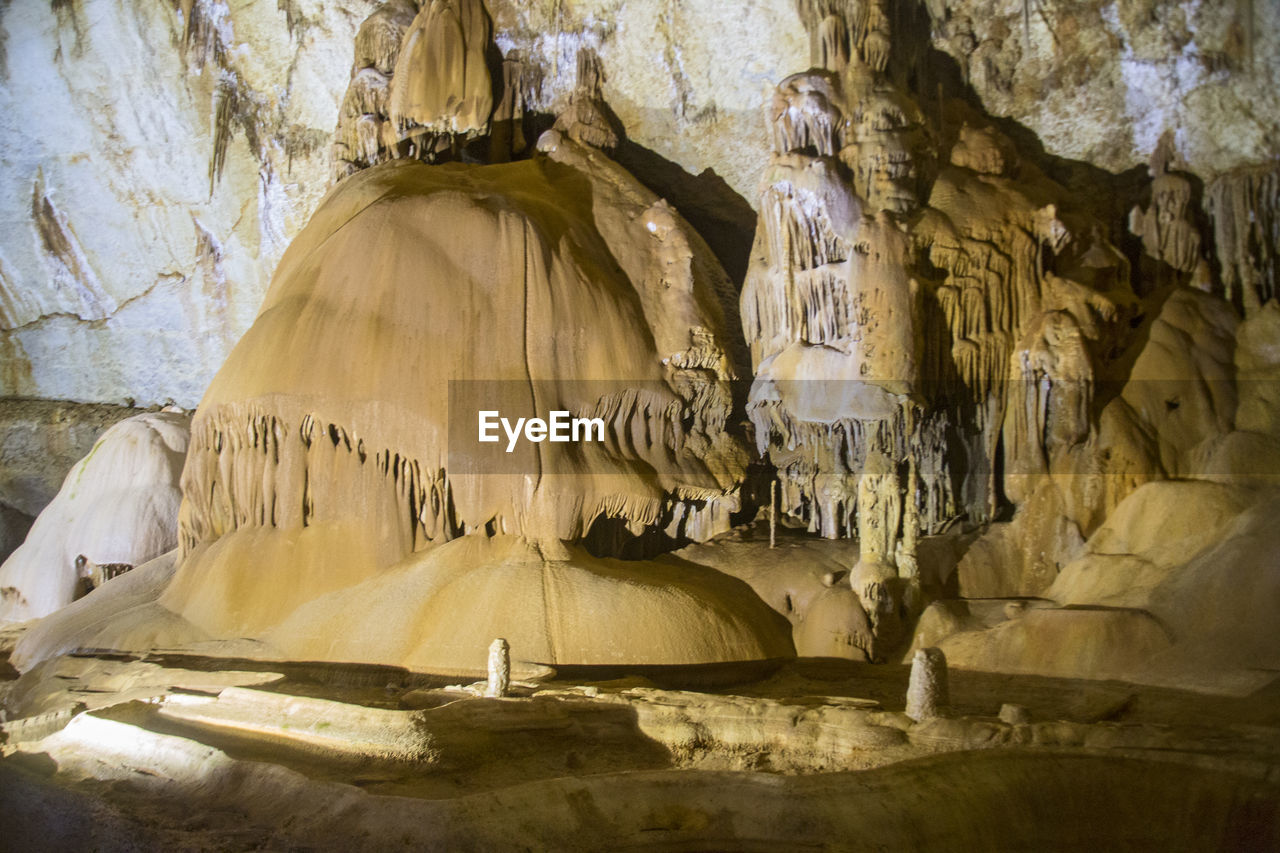 LOW ANGLE VIEW OF ROCK FORMATION IN CAVE