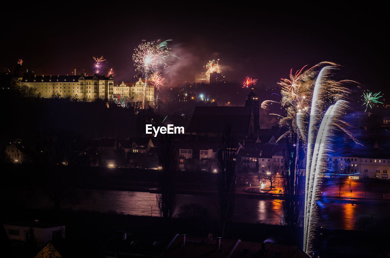 Fire crackers against built structures at night