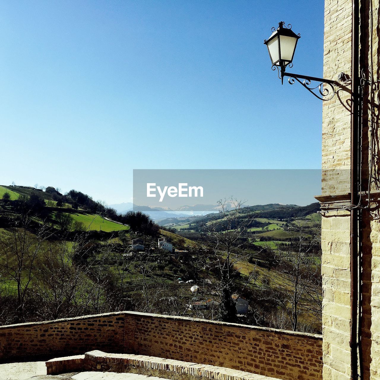 Scenic view of mountains against clear blue sky