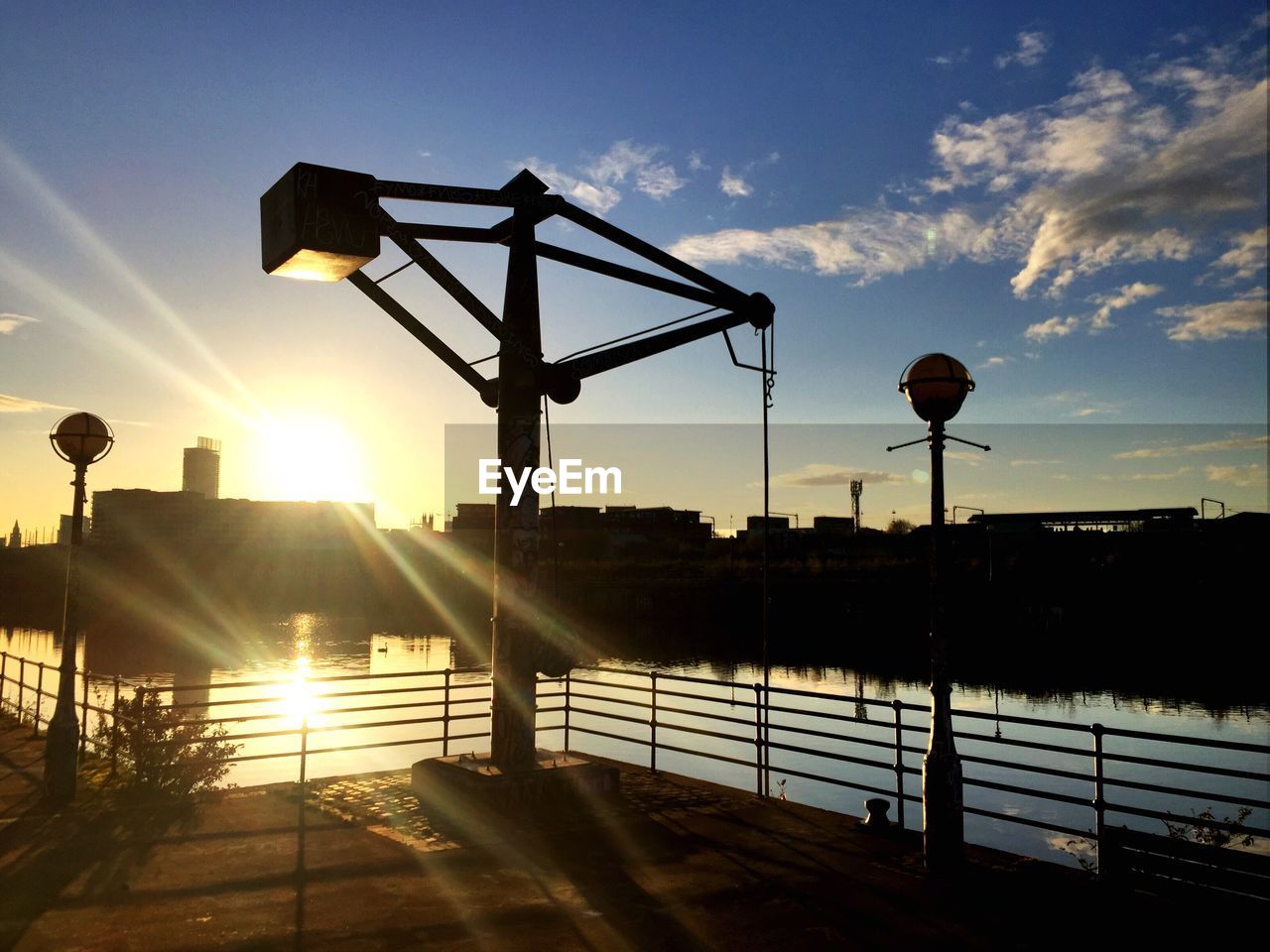 Silhouette of building against sky during sunset