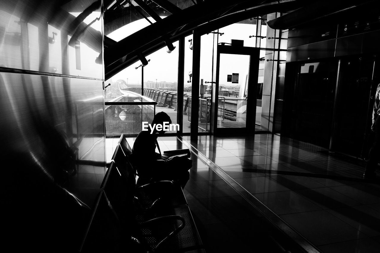 TRAIN ON RAILROAD STATION PLATFORM