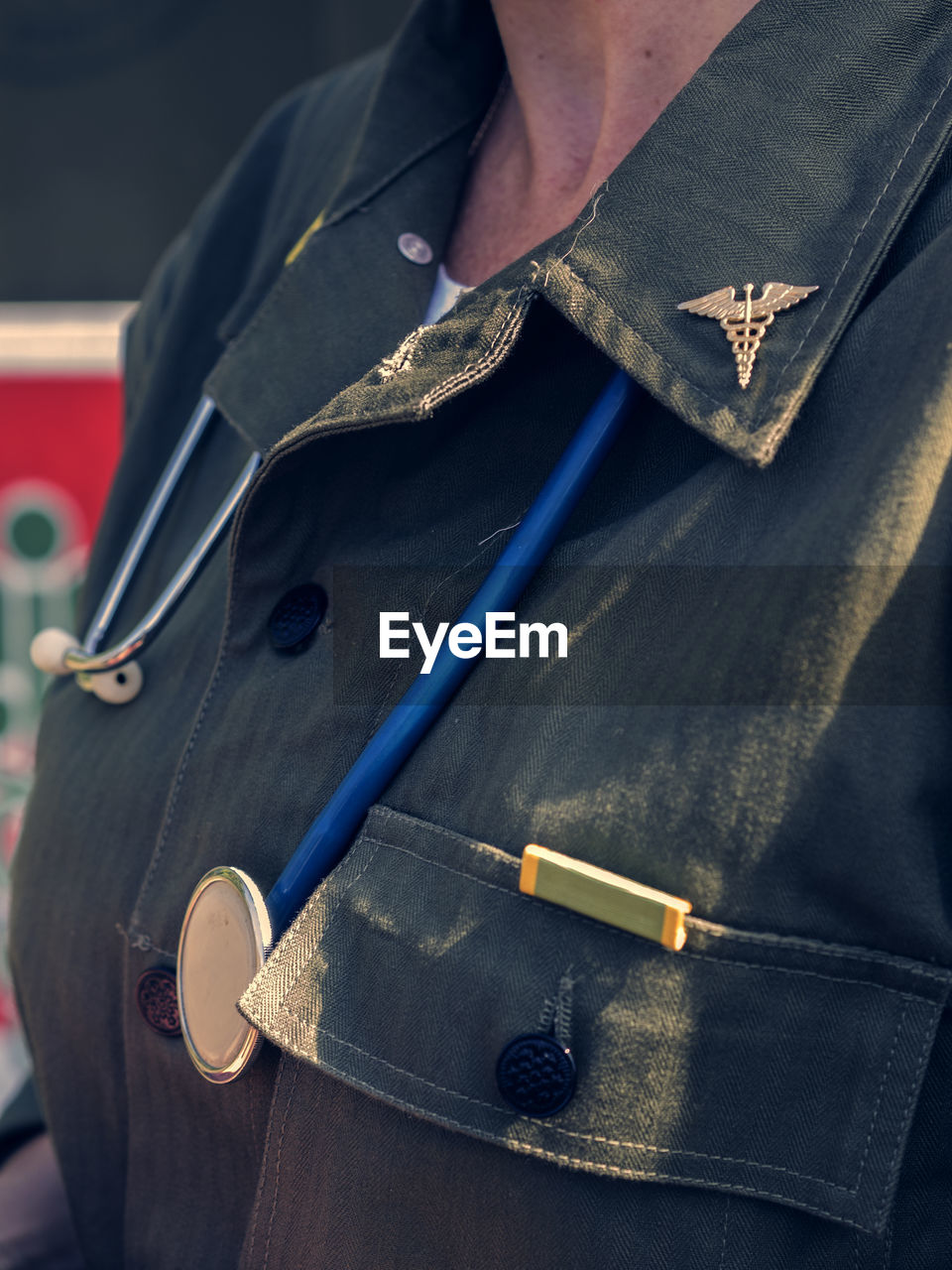 Midsection of female soldier with stethoscope