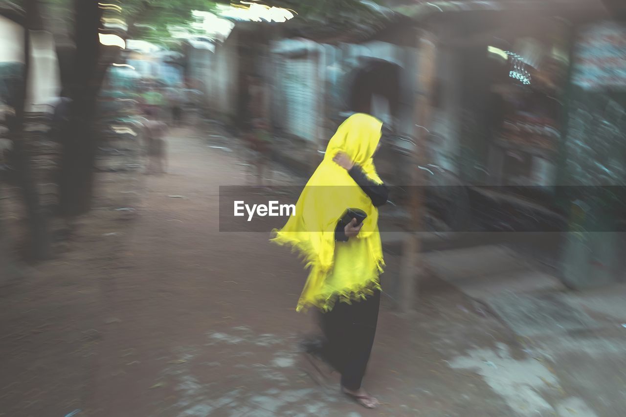 Woman walking on street