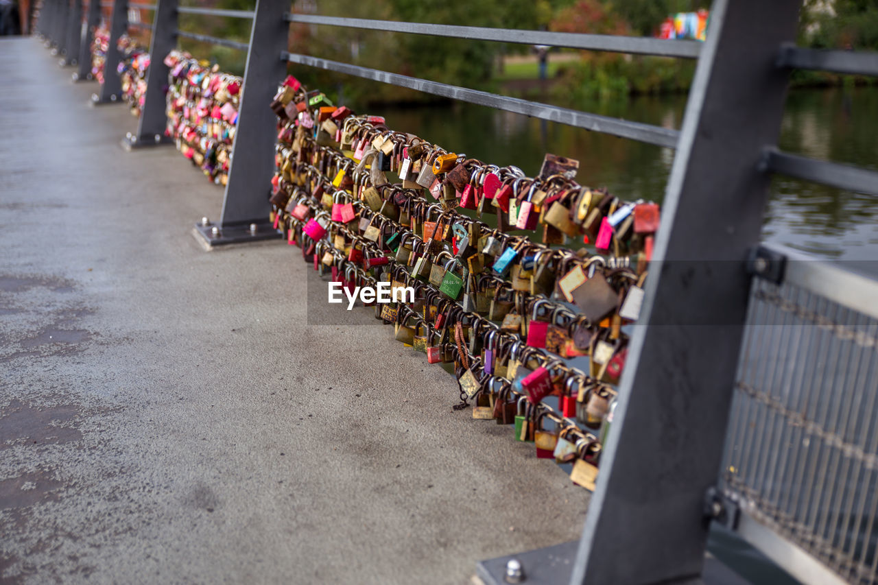 High angle view of love locks on railing
