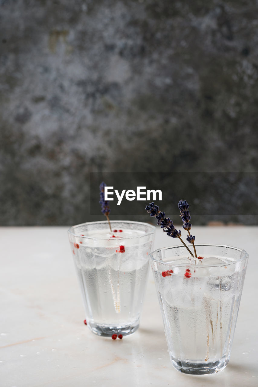 CLOSE-UP OF GLASS OF JUICE