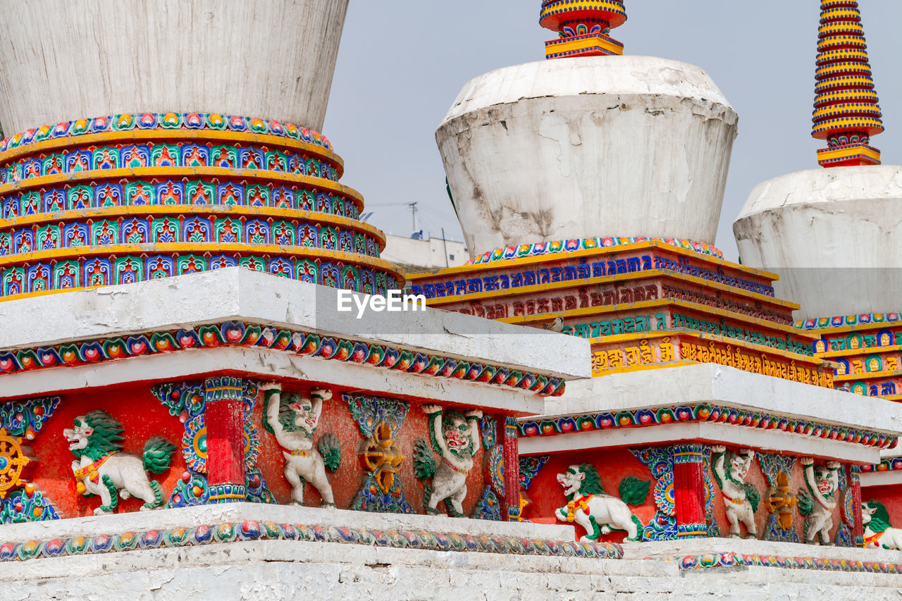 Colorful painting on a tibetan stupa at the picturesque kumbum champa ling monastery, xining, china