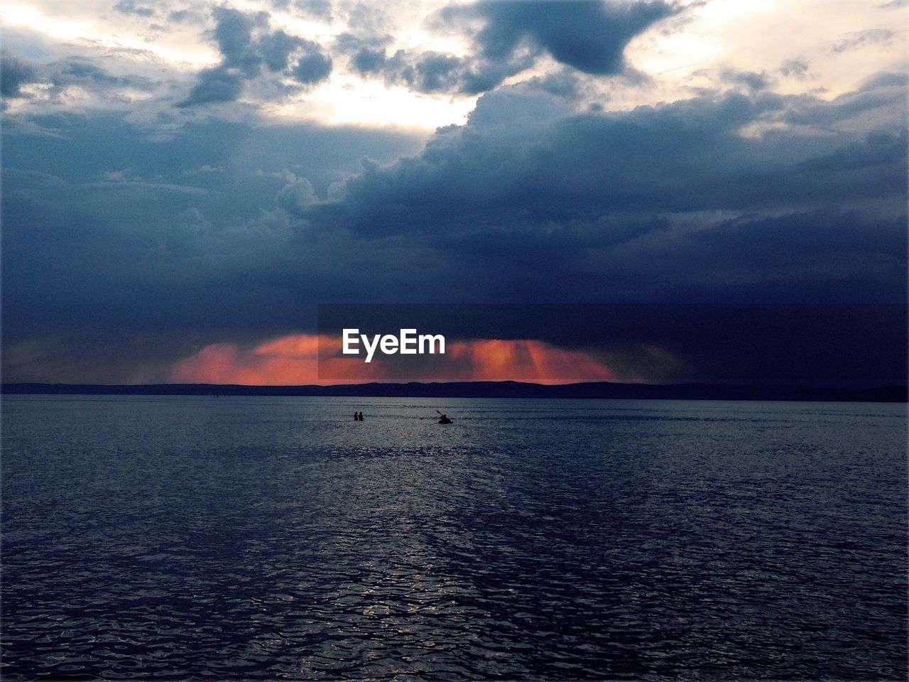 Scenic view of sea against dramatic sky