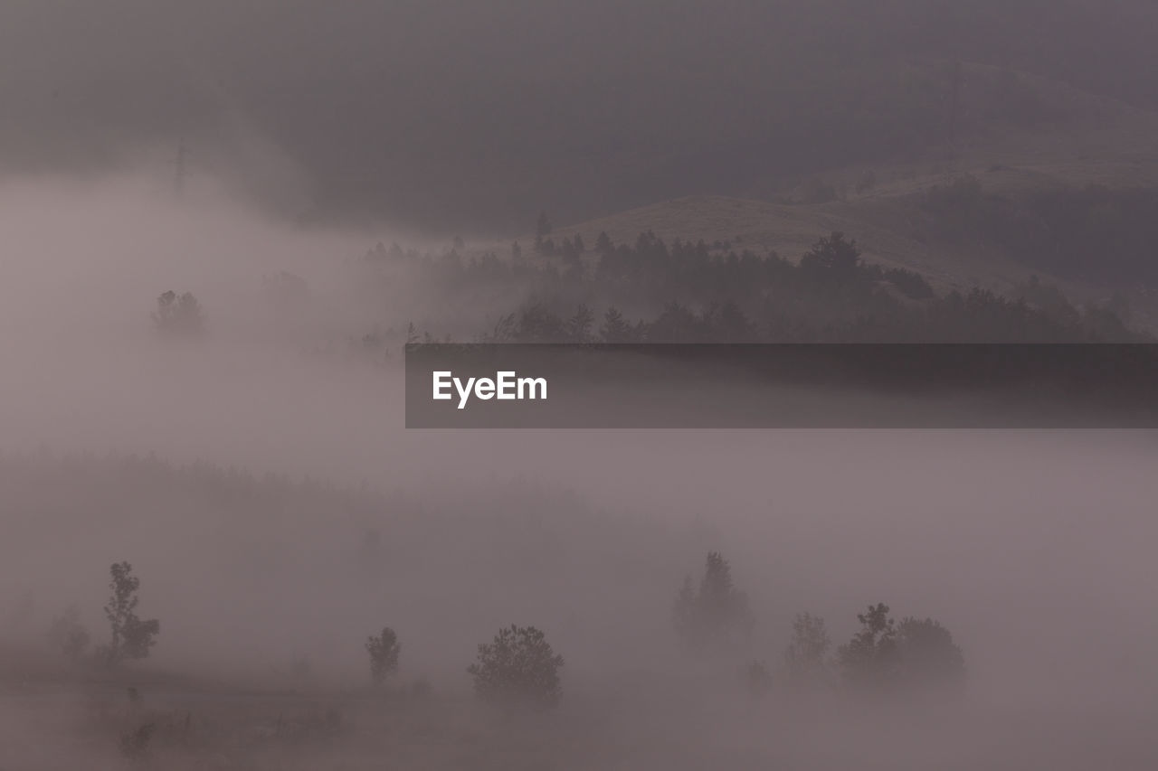 Scenic view of landscape against sky during winter