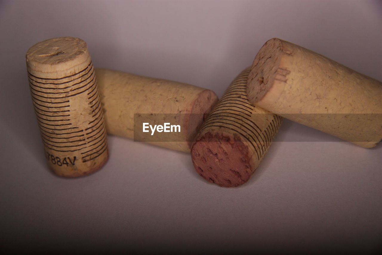 High angle view of wine corks on white background