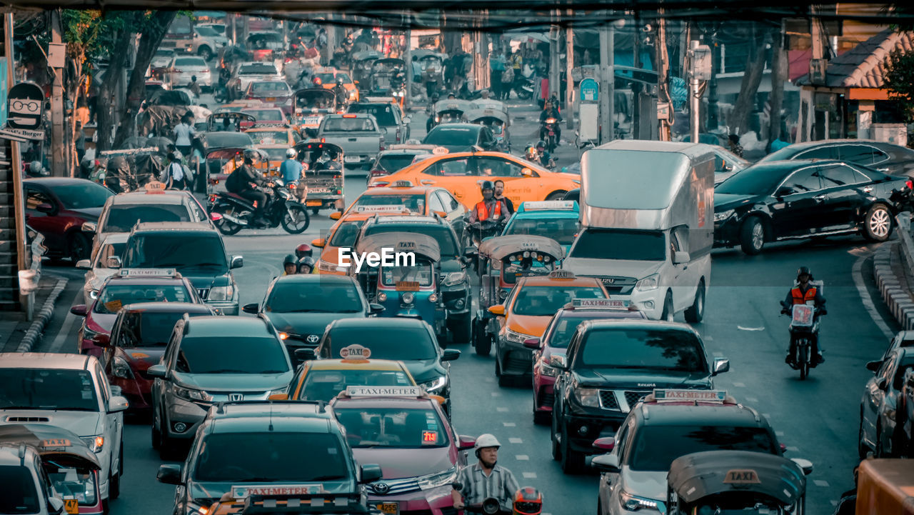 VEHICLES ON ROAD IN CITY