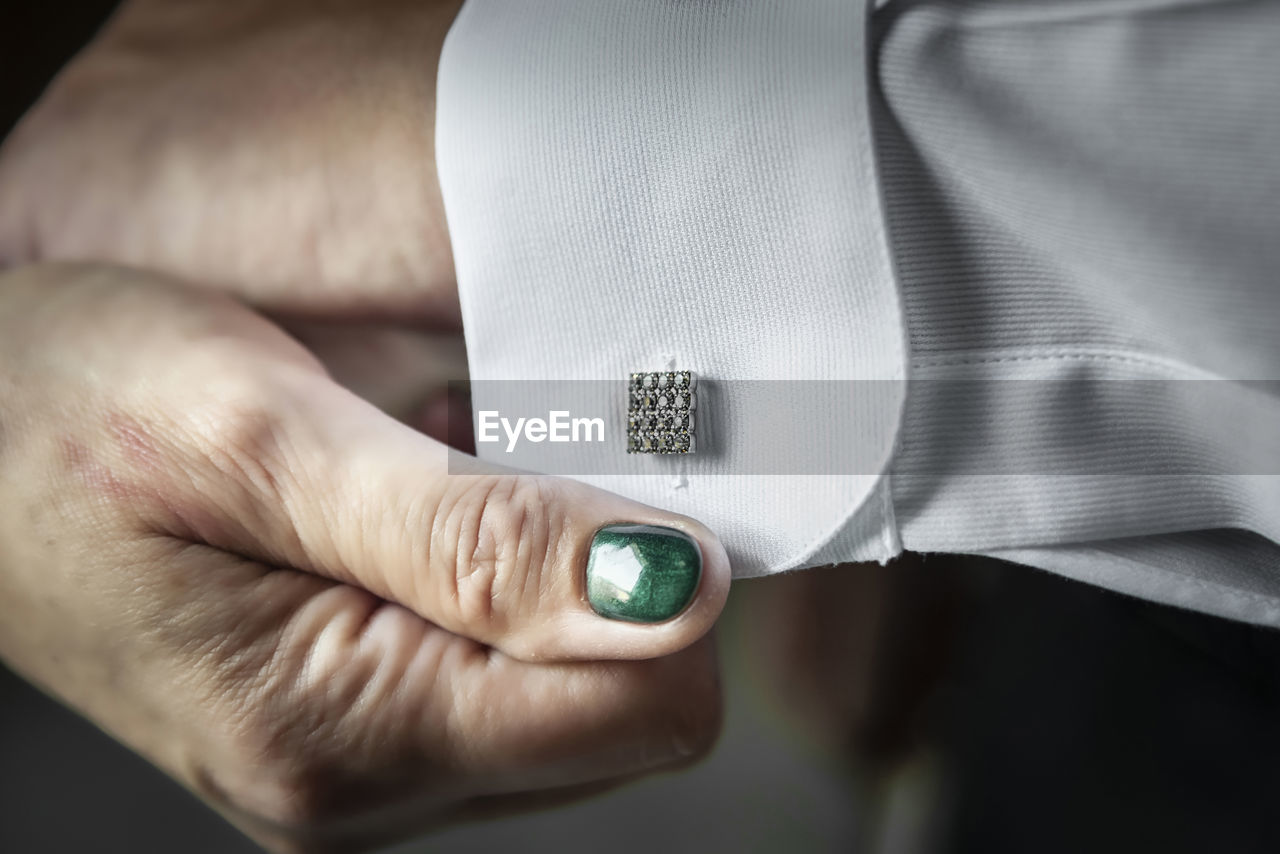 Close-up of woman with cufflink