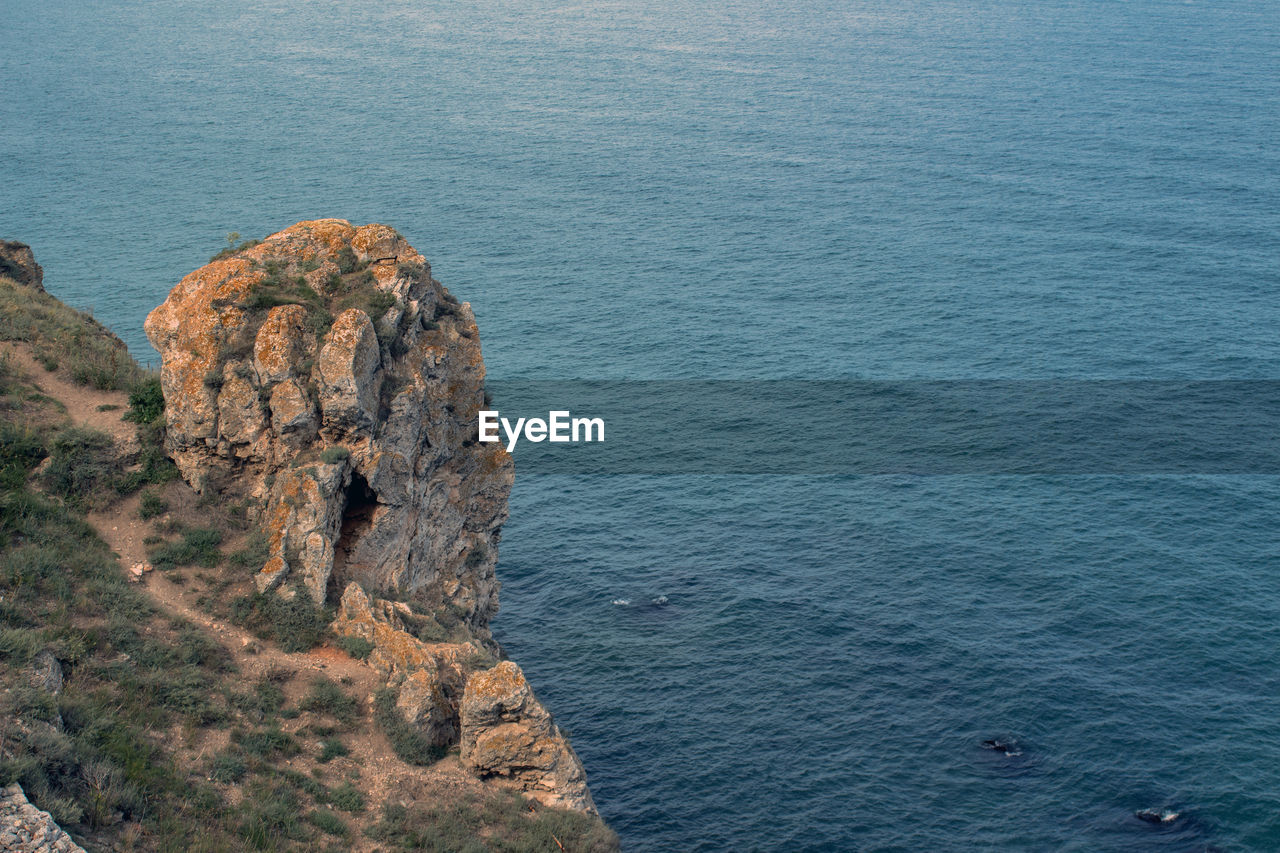 High angle view of rock formation in sea