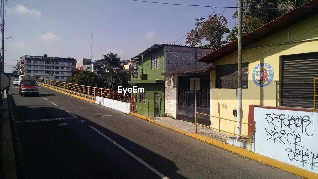 HOUSES AGAINST SKY