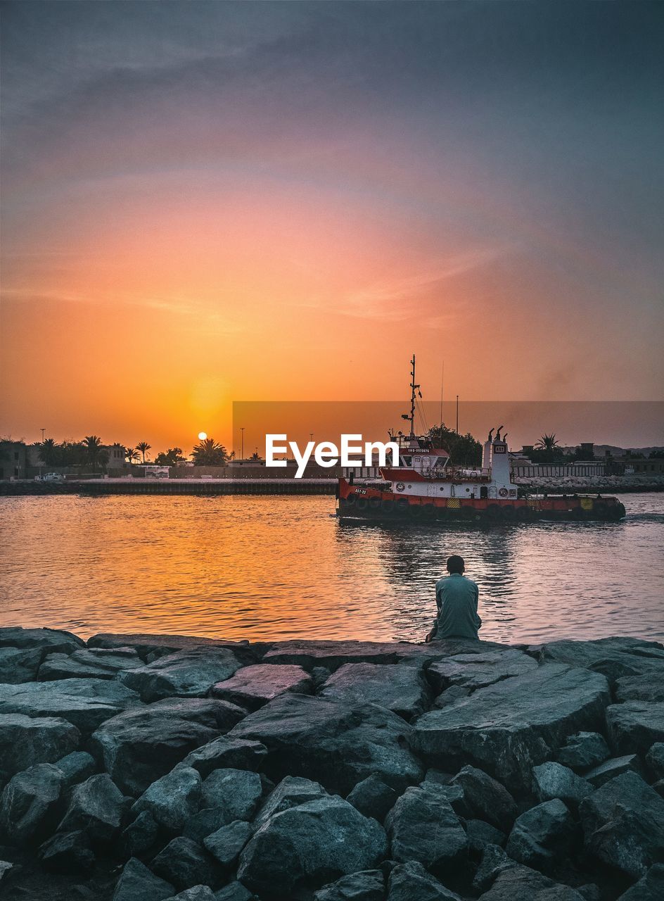 SHIP ON SEA AT SUNSET