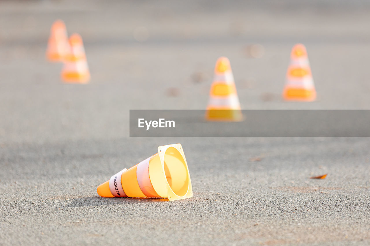 Yellow traffic cones on road