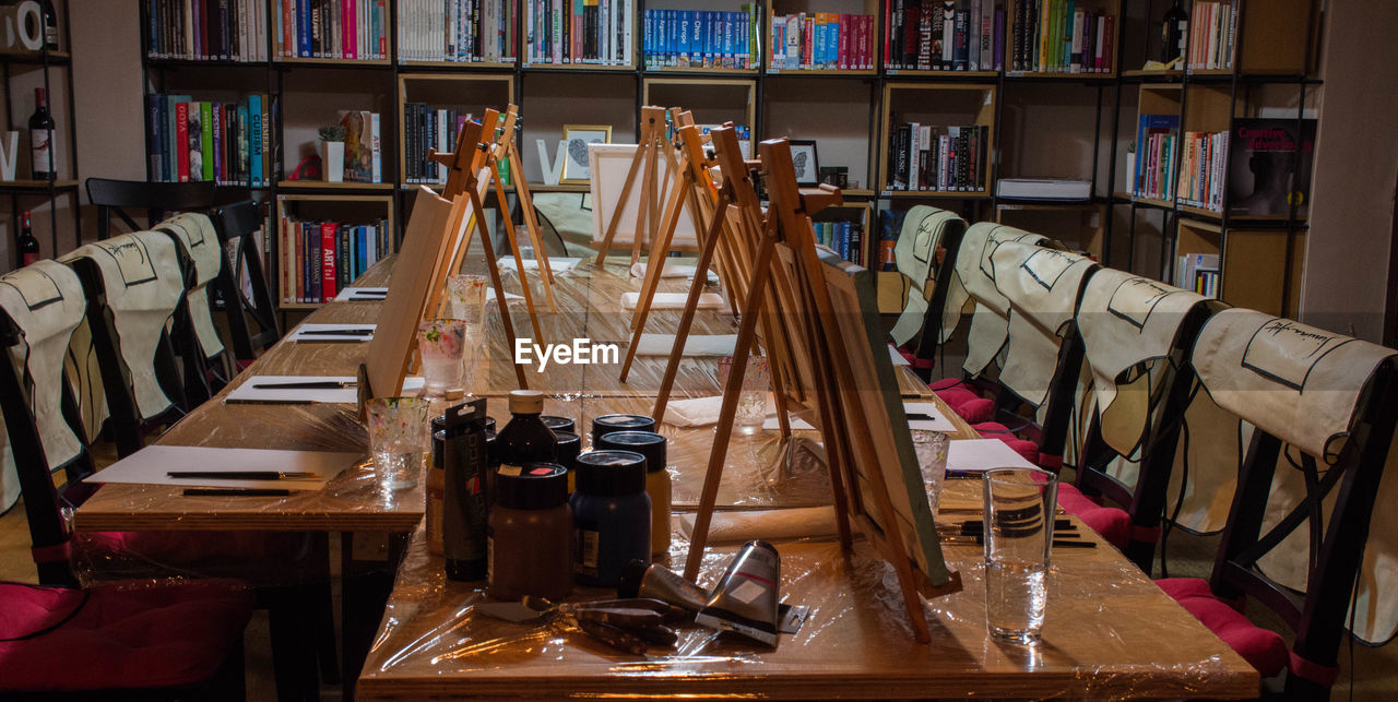 VIEW OF BOOKS ON TABLE IN SHELF