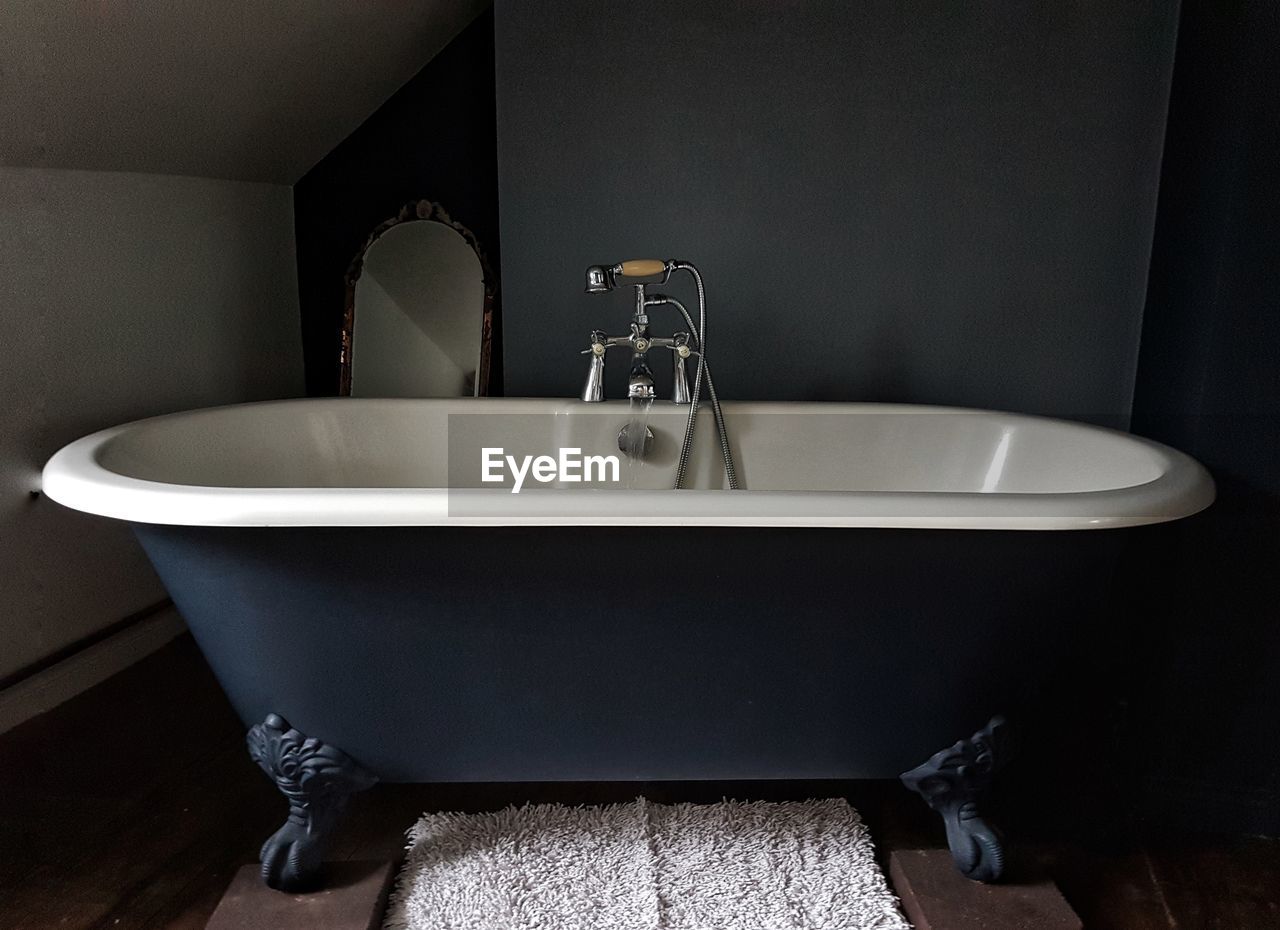 Close-up of bathtub in bathroom at home