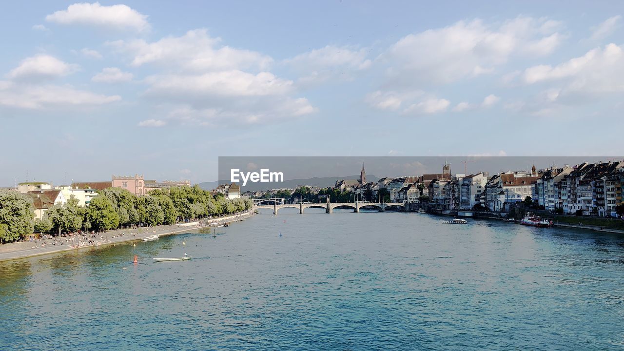 Panoramic view of sea and buildings against sky