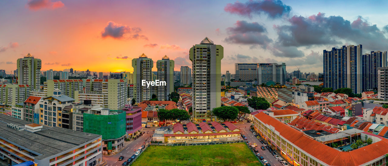 High angle view of buildings against sky during sunset