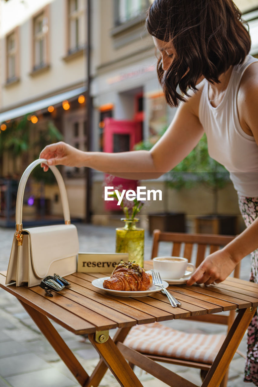 high angle view of woman preparing food at table