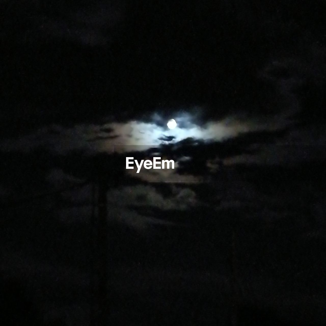 LOW ANGLE VIEW OF MOON AT NIGHT SKY