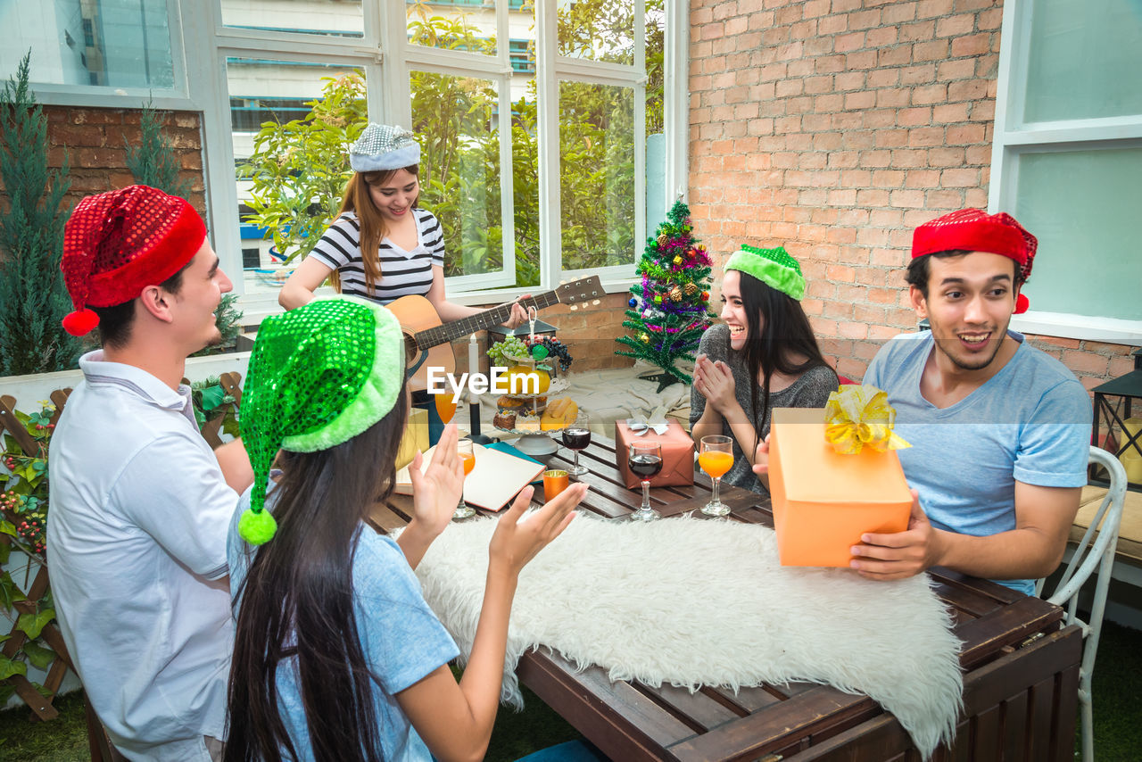 Friends enjoying party at restaurant