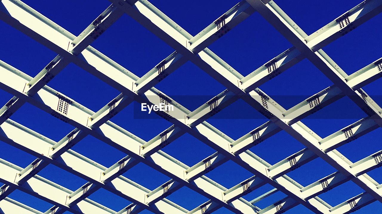 Full frame shot of a ceiling against a blue sky