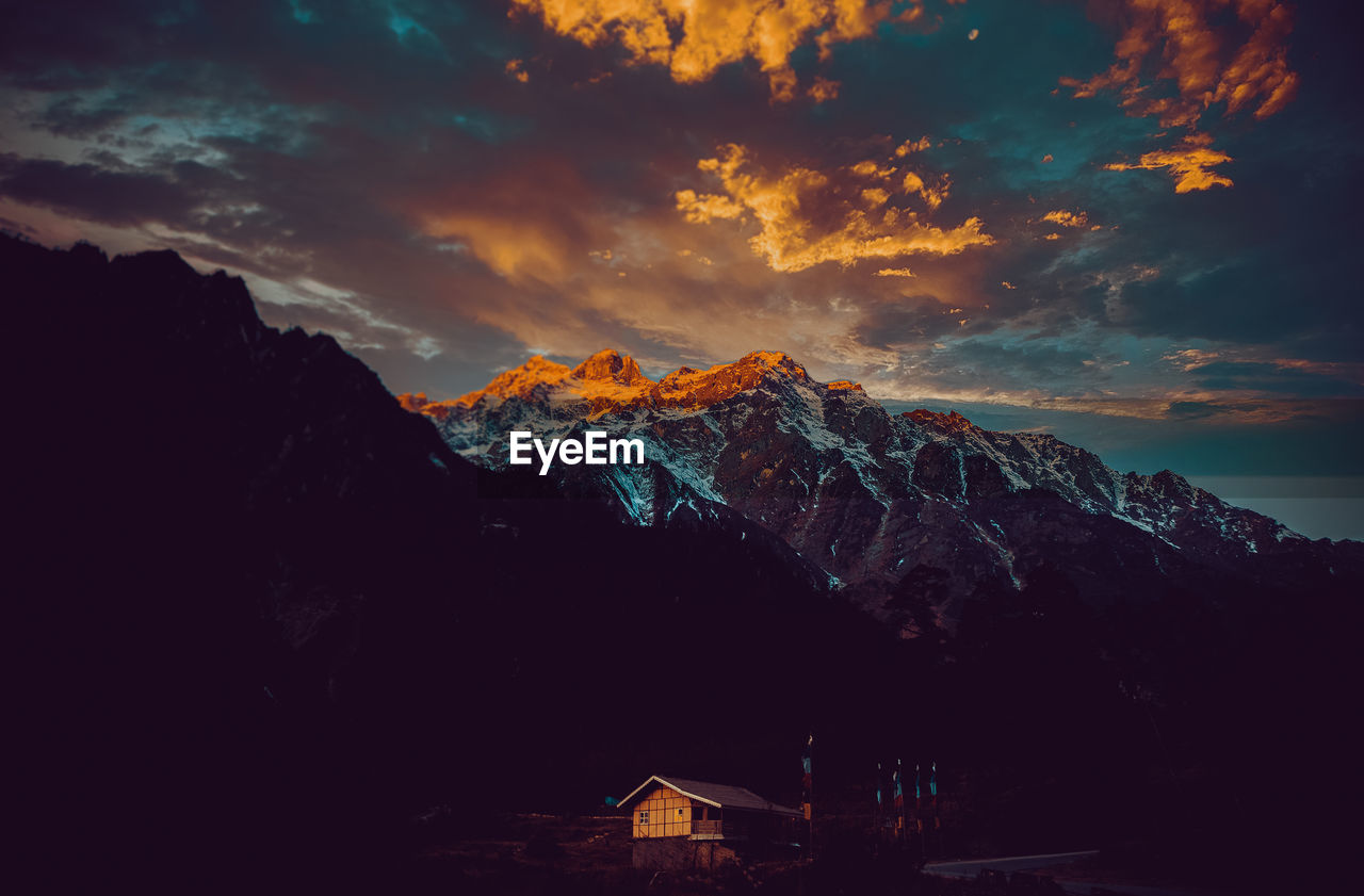 Scenic view of mountains against sky during sunset